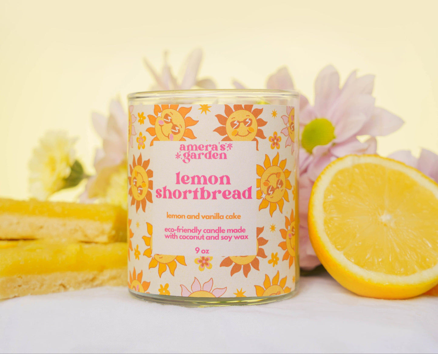 lemon shortbread candle by amera's garden with lemon and flowers in background
