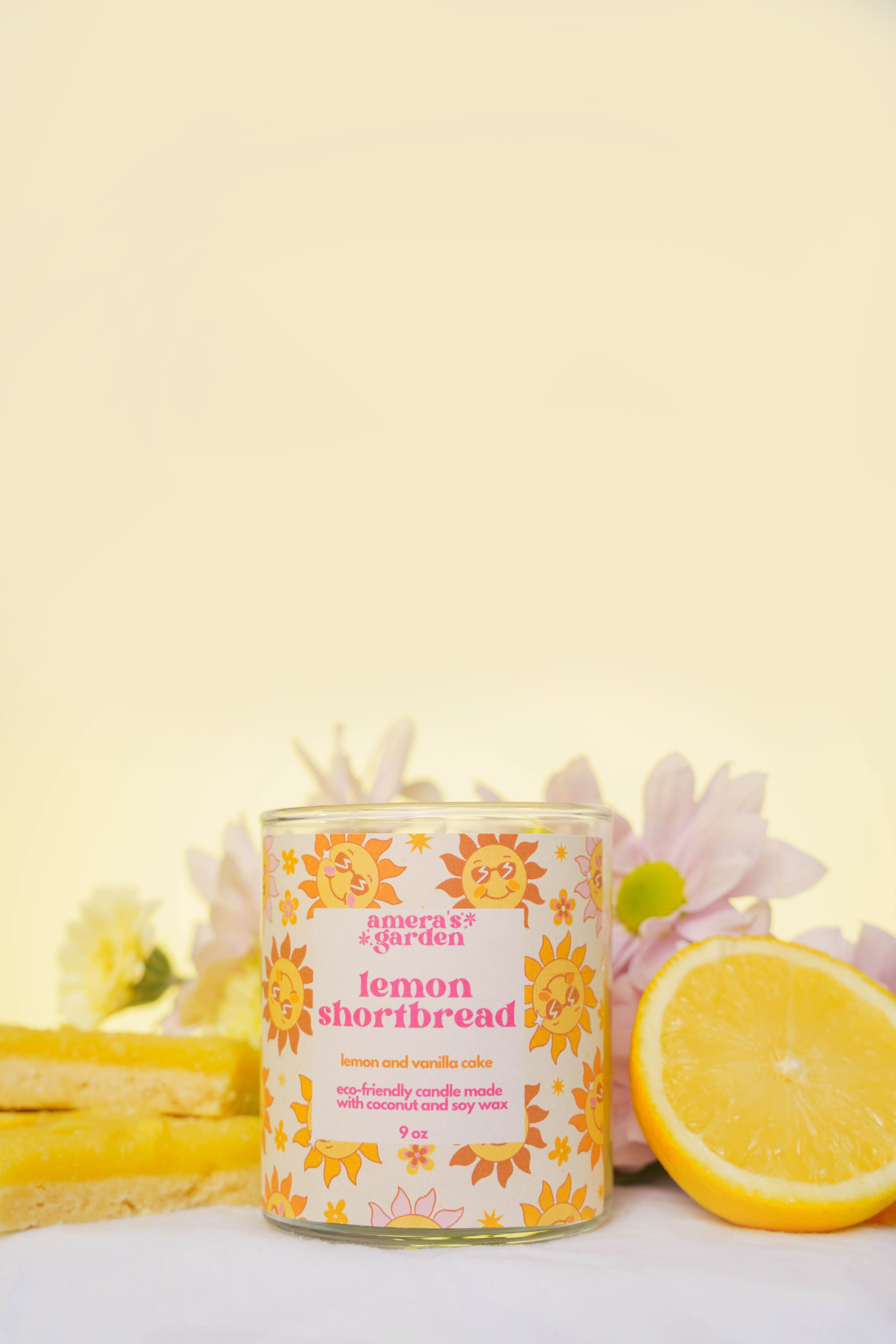 lemon shortbread candle by amera's garden with lemon and flowers in background
